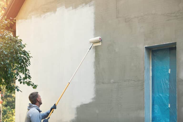 painter painting building exterior