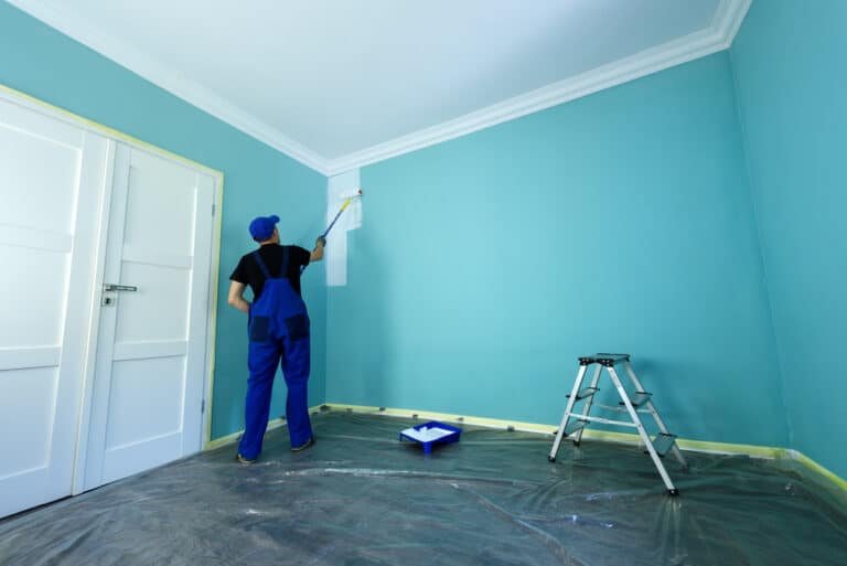 Man painting the wall